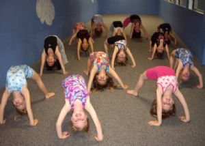 Class of Young Girls Practicing Arches